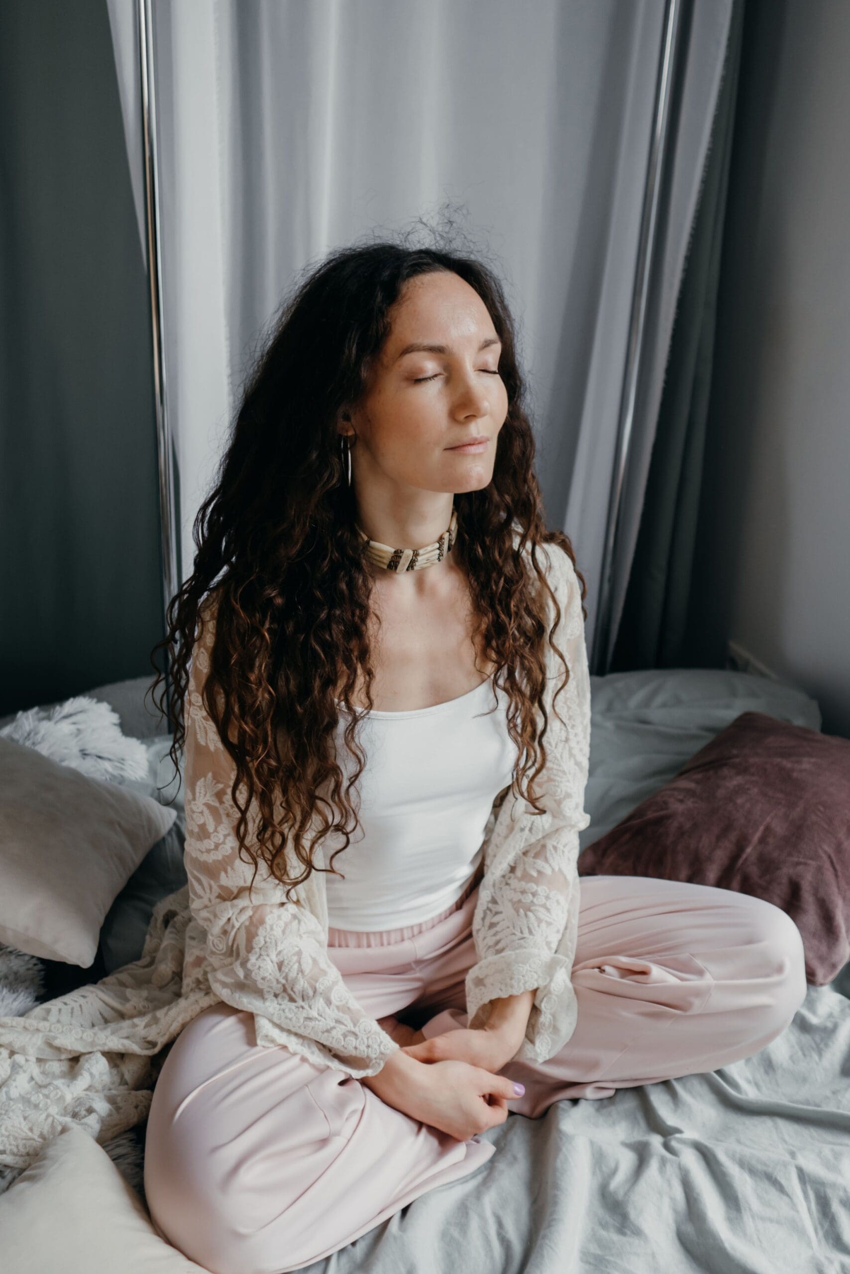 women meditating eyes closed spiritual healing